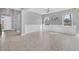 Spacious living room with natural light, tile floors, and decorative wainscoting at 5833 Millennium Silver Ct, Sarasota, FL 34238