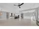 Spacious living area with open floorplan to the kitchen and views of the backyard at 5833 Millennium Silver Ct, Sarasota, FL 34238