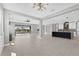 Bright and airy living room with an open concept, connecting to the modern kitchen and scenic views at 5833 Millennium Silver Ct, Sarasota, FL 34238