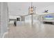 Open floor plan showcasing a spacious living area connected to the kitchen with modern finishes and fixtures at 5833 Millennium Silver Ct, Sarasota, FL 34238