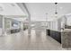 Spacious living room with tile floors, large windows, and an open layout at 5833 Millennium Silver Ct, Sarasota, FL 34238
