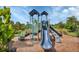 Well-maintained community playground with slides, climbing structures, and safe play surfaces at 5833 Millennium Silver Ct, Sarasota, FL 34238