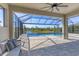 Screened-in pool and patio area with a beautiful scenic view, perfect for relaxing outdoors at 5833 Millennium Silver Ct, Sarasota, FL 34238