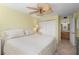 This bedroom has a ceiling fan and access to the bathroom. It also has large closet doors at 5855 Midnight Pass Rd # 204, Sarasota, FL 34242