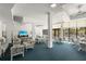 Cozy common room with comfortable seating arrangements and a large screen television for entertainment at 5855 Midnight Pass Rd # 204, Sarasota, FL 34242