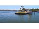 Picturesque boat dock with boats, a gazebo, and waterfront seating areas providing stunning views at 5855 Midnight Pass Rd # 204, Sarasota, FL 34242