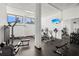 Well-equipped gym featuring modern equipment and a wall-mounted TV for an enjoyable workout experience at 5855 Midnight Pass Rd # 204, Sarasota, FL 34242