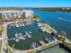 Aerial view of a full service marina with numerous boat slips and waterway access at 5855 Midnight Pass Rd # 204, Sarasota, FL 34242