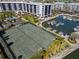 Aerial view of the community tennis courts by the marina and building at 5855 Midnight Pass Rd # 204, Sarasota, FL 34242