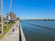 Scenic waterfront view featuring seating areas and a tranquil river for a relaxing experience at 5855 Midnight Pass Rd # 204, Sarasota, FL 34242