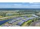 An aerial view of single-Gathering homes in a community with many large ponds at 6260 Fish Eagle Ct, Nokomis, FL 34275