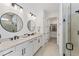 Elegant bathroom with double vanity, modern fixtures, and a glass-enclosed shower, providing a spa-like experience at 6260 Fish Eagle Ct, Nokomis, FL 34275