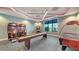 Fun game room featuring arcade games, shuffleboard, and air hockey at 6260 Fish Eagle Ct, Nokomis, FL 34275