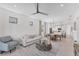 Spacious open-concept living area with white walls and a view into the connected kitchen at 6260 Fish Eagle Ct, Nokomis, FL 34275