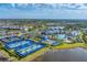 Aerial view of the community pickleball courts, pool, and community center at 6260 Fish Eagle Ct, Nokomis, FL 34275