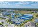 Aerial view of the community tennis courts, pool, and community center at 6260 Fish Eagle Ct, Nokomis, FL 34275