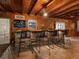 Stylish indoor bar area featuring stone accents, comfortable seating, and a cozy atmosphere at 6308 Caracara St, Sarasota, FL 34241