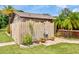 Outdoor shower area with privacy fence and lush landscaping, offering a refreshing escape at 6308 Caracara St, Sarasota, FL 34241