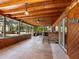 Beautiful outdoor patio area featuring a brick bar with barstool seating and a wood plank ceiling at 6308 Caracara St, Sarasota, FL 34241