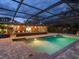 Gorgeous backyard pool with brick patio, and covered bar offering an ideal outdoor entertainment space at 6308 Caracara St, Sarasota, FL 34241