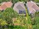Backyard view with patio screened in with trees at 6310 Golden Eye Gln, Lakewood Ranch, FL 34202