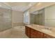 Bright bathroom featuring a soaking tub, glass enclosed shower and double sink vanity at 6310 Golden Eye Gln, Lakewood Ranch, FL 34202