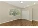 Bright bedroom with hardwood floors, large window and closet space at 6310 Golden Eye Gln, Lakewood Ranch, FL 34202
