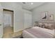 Bedroom with soft lighting, closet, and neutral decor creates a relaxing atmosphere at 6310 Golden Eye Gln, Lakewood Ranch, FL 34202