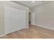 Bedroom featuring hardwood floors, double closet, and ample natural light at 6310 Golden Eye Gln, Lakewood Ranch, FL 34202