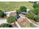 Aerial view of a community park featuring playgrounds, swing sets, and walking paths at 6310 Golden Eye Gln, Lakewood Ranch, FL 34202
