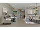Inviting living room with chairs, rug, dining table, and sliding glass doors to the outdoors at 6310 Golden Eye Gln, Lakewood Ranch, FL 34202