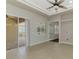 Spacious living area with sliding glass doors to the patio and bright natural light at 6310 Golden Eye Gln, Lakewood Ranch, FL 34202