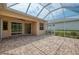Screened-in patio showing access to both the interior and backyard, ideal for Florida living at 6310 Golden Eye Gln, Lakewood Ranch, FL 34202
