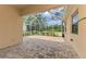 Screened-in patio with brick flooring, perfect for enjoying the outdoors bug-free at 6310 Golden Eye Gln, Lakewood Ranch, FL 34202