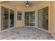 Covered patio featuring brick flooring with several glass doors and windows, great for entertaining at 6310 Golden Eye Gln, Lakewood Ranch, FL 34202