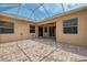 Wide view of the screened-in patio with brick flooring, offering an outdoor entertainment area at 6310 Golden Eye Gln, Lakewood Ranch, FL 34202