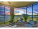 Screened lanai featuring scenic views, comfortable seating, and lush greenery at 6370 Watercrest Way # 402, Lakewood Ranch, FL 34202