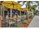 Outdoor patio with seating and shade, perfect for enjoying meals and socializing at the community restaurant at 667 Crossfield Cir # 1, Venice, FL 34293