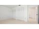 Spacious bedroom featuring two large closets and neutral carpeting at 6813 7Th W Ave, Bradenton, FL 34209