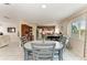 Cozy dining area with a round table, seating for four, and access to the kitchen at 7002 Primm Pl, North Port, FL 34287