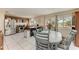 Inviting dining area featuring an island, stainless appliances, and a view of the backyard at 7002 Primm Pl, North Port, FL 34287