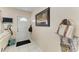 Bright entryway features tile flooring, a decorative wall hanging, and ample space at 7002 Primm Pl, North Port, FL 34287
