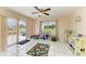 Bright and airy play room with sliding doors, colorful decor, and tile flooring at 7002 Primm Pl, North Port, FL 34287