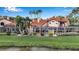 Beautiful backyard with screened-in patio and hot tub that overlooks a pond at 7309 Regina Royale Blvd # 21, Sarasota, FL 34238