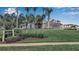 Tournament Players Club exterior with landscaping, clubhouse sign and street view at 7309 Regina Royale Blvd # 21, Sarasota, FL 34238