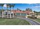 Aerial view of the Tournament Players Club with lush lawns, mature trees, and ample parking at 7309 Regina Royale Blvd # 21, Sarasota, FL 34238