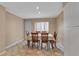 Sunny dining area with a classic table setting and neutral tones at 7309 Regina Royale Blvd # 21, Sarasota, FL 34238