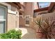 Charming front entry with neutral colors and well-maintained landscaping surrounding the walkway at 7309 Regina Royale Blvd # 21, Sarasota, FL 34238