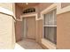 Inviting front entry featuring a stylish door, sidelight window, and neutral color palette at 7309 Regina Royale Blvd # 21, Sarasota, FL 34238