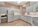 Bright kitchen features white cabinetry, ample counter space, and tile flooring, perfect for culinary creations at 7309 Regina Royale Blvd # 21, Sarasota, FL 34238